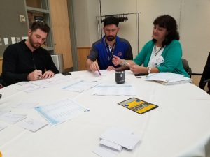 Graciela consults with two student veterans during the AUTHENTIC Personal Branding for Military Veterans workshop at the University of Idaho